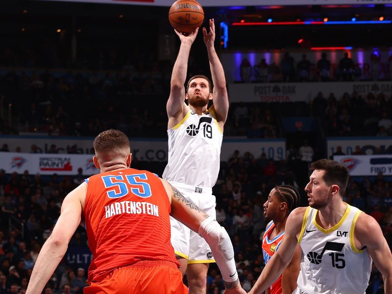 OKLAHOMA CITY, OK - DECEMBER 3: Svi Mykhailiuk #19 of the Utah Jazz shoots a three point basket during the game against the Oklahoma City Thunder during the Emirates NBA Cup game on on December 3, 2024 at Paycom Center in Oklahoma City, Oklahoma. NOTE TO USER: User expressly acknowledges and agrees that, by downloading and or using this photograph, User is consenting to the terms and conditions of the Getty Images License Agreement. Mandatory Copyright Notice: Copyright 2024 NBAE (Photo by Zach Beeker/NBAE via Getty Images)