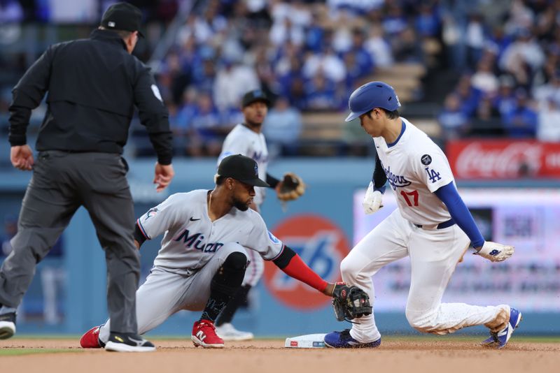 Apr 28, 2025; Los Angeles, California, USA;  Los Angeles Dodgers two-way player Shohei Ohtani (17) steals second base in the first inning against the Miami Marlins during the first inning at Dodger Stadium. Mandatory Credit: Jason Parkhurst-Imagn Images