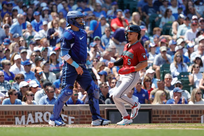 Jul 19, 2024; Chicago, Illinois, USA; Arizona Diamondbacks outfielder Alek Thomas (5) scores against the Chicago Cubs during the third inning at Wrigley Field. Mandatory Credit: Kamil Krzaczynski-USA TODAY Sports