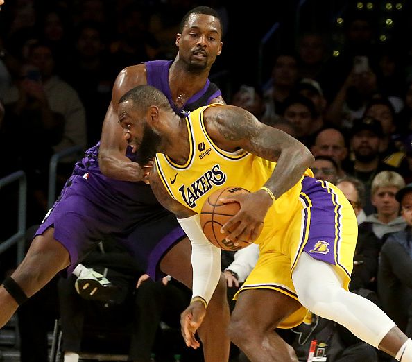 Los Angeles, CA -  Lakers forward LeBron James works the ball inside against Kings forward Harrison Barnes in the second half at crypto.com Arena in Los Angeles on Wednesday night, Nov. 15, 2023. (Luis Sinco / Los Angeles Times via Getty Images)