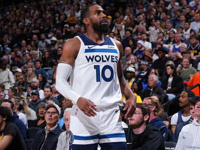 DENVER, CO - APRIL 10: Mike Conley #10 of the Minnesota Timberwolves looks on during the game against the Denver Nuggets on April 10, 2024 at the Ball Arena in Denver, Colorado. NOTE TO USER: User expressly acknowledges and agrees that, by downloading and/or using this Photograph, user is consenting to the terms and conditions of the Getty Images License Agreement. Mandatory Copyright Notice: Copyright 2024 NBAE (Photo by Garrett Ellwood/NBAE via Getty Images)