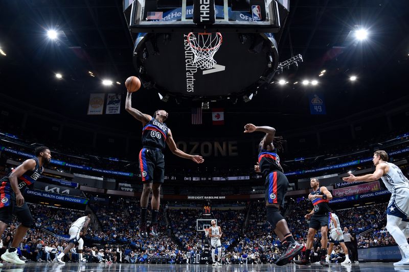 ORLANDO, FL - NOVEMBER 23: Ron Holland II #00 of the Detroit Pistons rebounds the ball during the game against the Orlando Magic on November 23, 2024 at Kia Center in Orlando, Florida. NOTE TO USER: User expressly acknowledges and agrees that, by downloading and or using this photograph, User is consenting to the terms and conditions of the Getty Images License Agreement. Mandatory Copyright Notice: Copyright 2024 NBAE (Photo by Fernando Medina/NBAE via Getty Images)