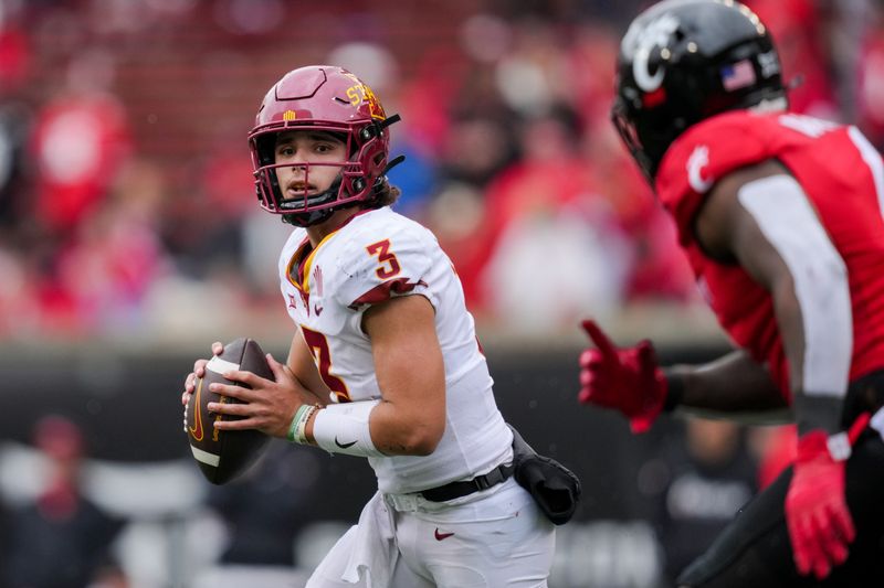 Oct 14, 2023; Cincinnati, Ohio, USA;  Iowa State Cyclones quarterback Rocco Becht (3) runs with the ball as he looks to pass against the Cincinnati Bearcats in the second half at Nippert Stadium. Mandatory Credit: Aaron Doster-USA TODAY Sports