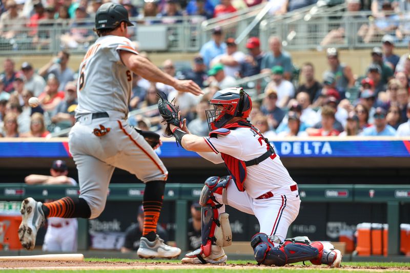 May 24, 2023; Minneapolis, Minnesota, USA; Minnesota Twins catcher Ryan Jeffers (27) fields the ball to tag out San Francisco Giants third baseman Casey Schmitt (6) at home plate during the second inning at Target Field. Mandatory Credit: Matt Krohn-USA TODAY Sports