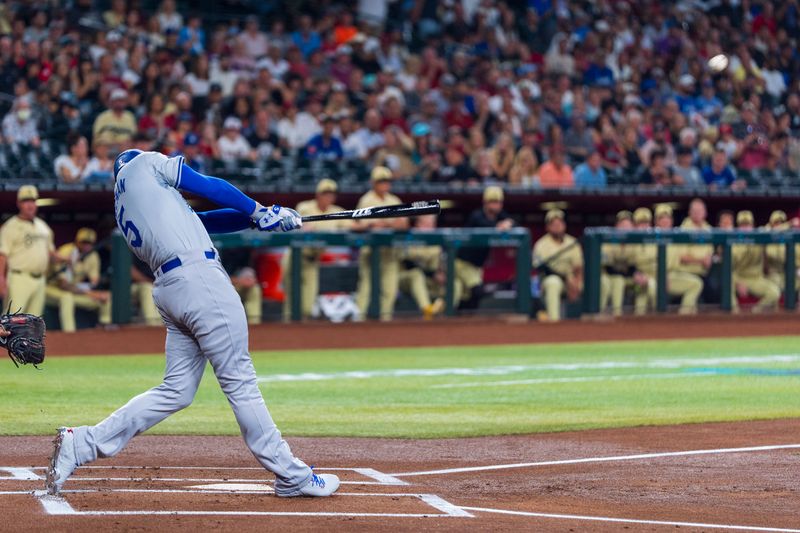 Aug 30, 2024; Phoenix, Arizona, USA;  Los Angeles Dodgers third baseman Freddie Freeman (5) hit a home run in the first inning during a game against the Arizona Diamondbacks at Chase Field. Mandatory Credit: Allan Henry-USA TODAY Sports