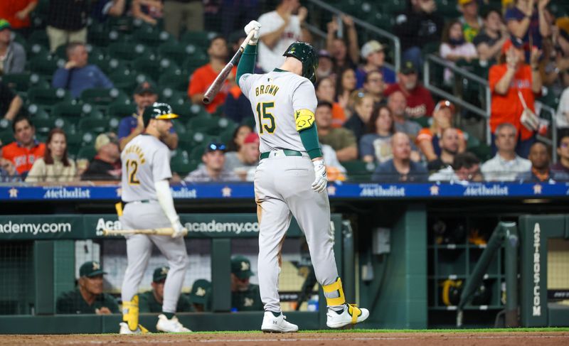 May 13, 2024; Houston, Texas, USA; Oakland Athletics left fielder Seth Brown (15) reacts after he struck out with two men in scoring position to end the eighth inning at Minute Maid Park. Mandatory Credit: Thomas Shea-USA TODAY Sports