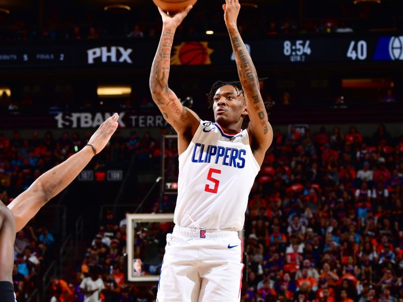 PHOENIX, AZ - APRIL 25: Bones Hyland #5 of the LA Clippers shoots the ball during the game against the Phoenix Suns during Round 1 Game 5 of the 2023 NBA Playoffs on April 25, 2023 at Footprint Center in Phoenix, Arizona. NOTE TO USER: User expressly acknowledges and agrees that, by downloading and or using this photograph, user is consenting to the terms and conditions of the Getty Images License Agreement. Mandatory Copyright Notice: Copyright 2023 NBAE (Photo by Barry Gossage/NBAE via Getty Images)