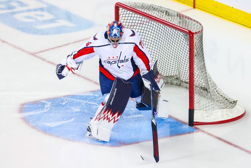 Mar 18, 2024; Calgary, Alberta, CAN; Washington Capitals goaltender Charlie Lindgren (79) warms up during the warmup period against the Calgary Flames at Scotiabank Saddledome. Mandatory Credit: Sergei Belski-USA TODAY Sports