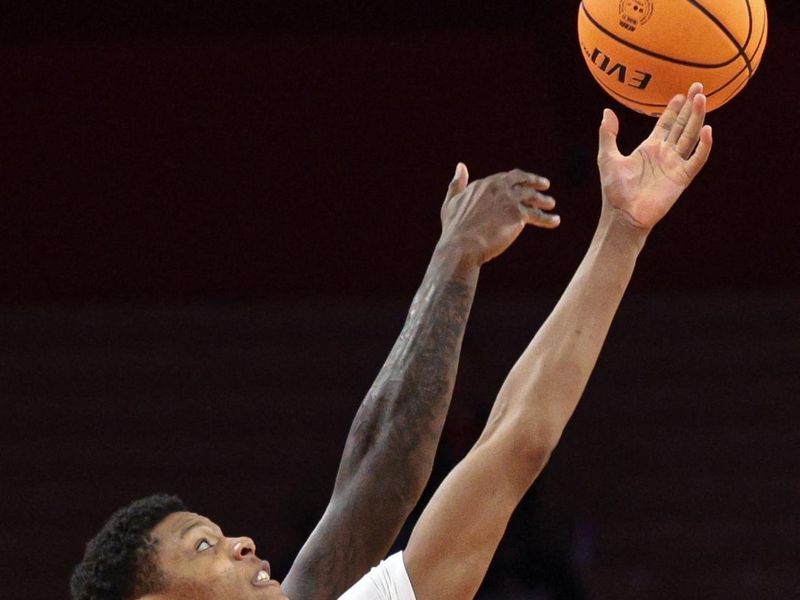 Feb 12, 2025; Piscataway, New Jersey, USA; Rutgers Scarlet Knights guard Ace Bailey (4) tips off to start the game against the Iowa Hawkeyes during the first half at Jersey Mike's Arena. Mandatory Credit: Vincent Carchietta-Imagn Images