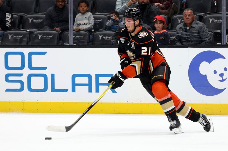 Mar 24, 2024; Anaheim, California, USA;  Anaheim Ducks center Isac Lundestrom (21) skates with the puck during the second period against the Tampa Bay Lightning  at Honda Center. Mandatory Credit: Jason Parkhurst-USA TODAY Sports