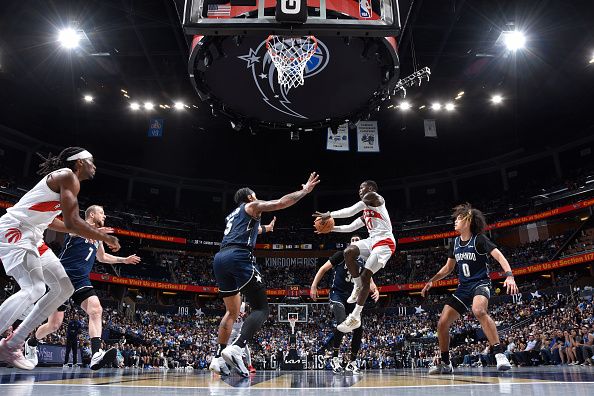 ORLANDO, FL - NOVEMBER 21: Dennis Schroder #17 of the Toronto Raptors looks to pass the ball during the game against the Orlando Magic during the In-Season Tournament on November 21, 2023 at Amway Center in Orlando, Florida. NOTE TO USER: User expressly acknowledges and agrees that, by downloading and or using this photograph, User is consenting to the terms and conditions of the Getty Images License Agreement. Mandatory Copyright Notice: Copyright 2023 NBAE (Photo by Fernando Medina/NBAE via Getty Images)