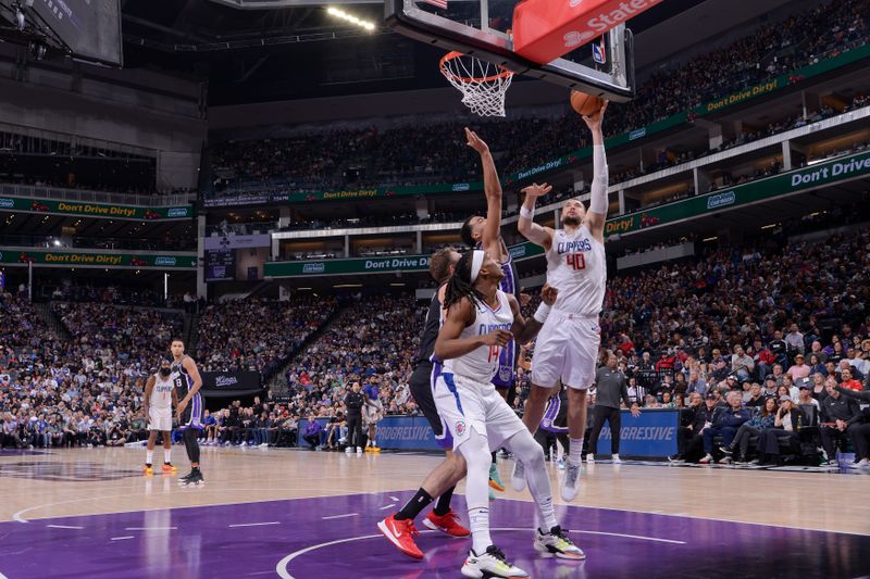 SACRAMENTO, CA - APRIL 2:  Ivica Zubac #40 of the LA Clippers goes to the basket during the game on April 2, 2024 at Golden 1 Center in Sacramento, California. NOTE TO USER: User expressly acknowledges and agrees that, by downloading and or using this Photograph, user is consenting to the terms and conditions of the Getty Images License Agreement. Mandatory Copyright Notice: Copyright 2024 NBAE (Photo by Rocky Widner/NBAE via Getty Images)