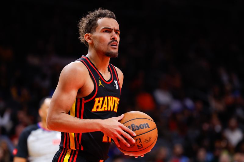 ATLANTA, GEORGIA - FEBRUARY 23: Trae Young #11 of the Atlanta Hawks reacts during the fourth quarter against the Toronto Raptors at State Farm Arena on February 23, 2024 in Atlanta, Georgia. NOTE TO USER: User expressly acknowledges and agrees that, by downloading and or using this photograph, User is consenting to the terms and conditions of the Getty Images License Agreement. (Photo by Todd Kirkland/Getty Images)