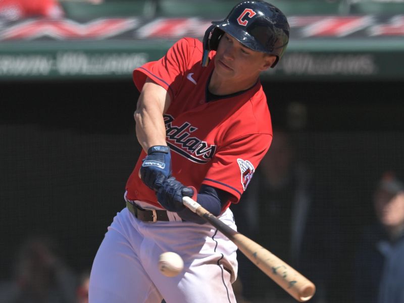 Apr 26, 2023; Cleveland, Ohio, USA; Cleveland Guardians outfielder Will Brennan (17) hist an RBI ground out during the eighth inning against the Colorado Rockies at Progressive Field. Mandatory Credit: Ken Blaze-USA TODAY Sports