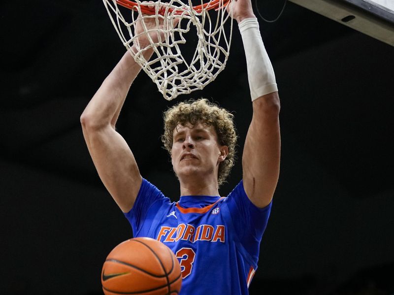 Jan 20, 2024; Columbia, Missouri, USA; Florida Gators center Micah Handlogten (3) dunks the ball during the second half against the Missouri Tigers at Mizzou Arena. Mandatory Credit: Jay Biggerstaff-USA TODAY Sports