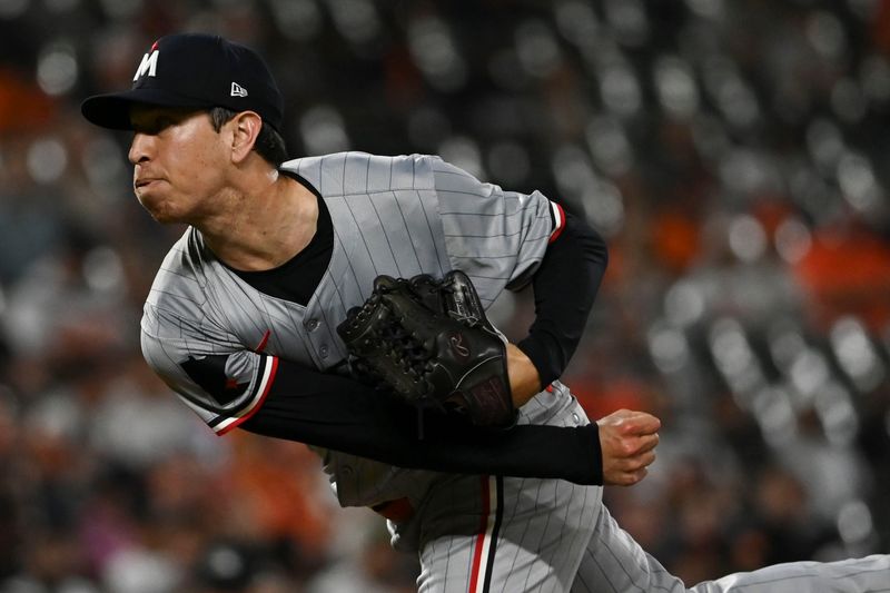 Apr 15, 2024; Baltimore, Maryland, USA; Minnesota Twins relief pitch John Moses delivers a eighth inning pitch against the Baltimore Orioles   at Oriole Park at Camden Yards. Mandatory Credit: Tommy Gilligan-USA TODAY Sports