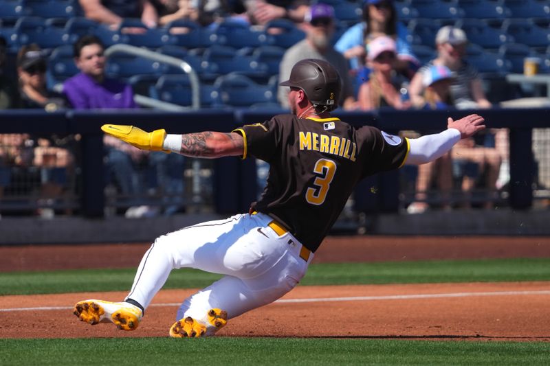 Mar 9, 2026; Peoria, Arizona, USA; San Diego Padres center fielder Jackson Merrill (3) slides into third base against the Texas Rangers during the first inning at Peoria Sports Complex. Mandatory Credit: Joe Camporeale-Imagn Images