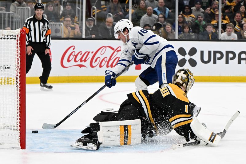 Feb 25, 2025; Boston, Massachusetts, USA; Toronto Maple Leafs right wing Mitch Marner (16) scores a goal on Boston Bruins goaltender Jeremy Swayman (1) during an overtime period at the TD Garden. Mandatory Credit: Brian Fluharty-Imagn Images
