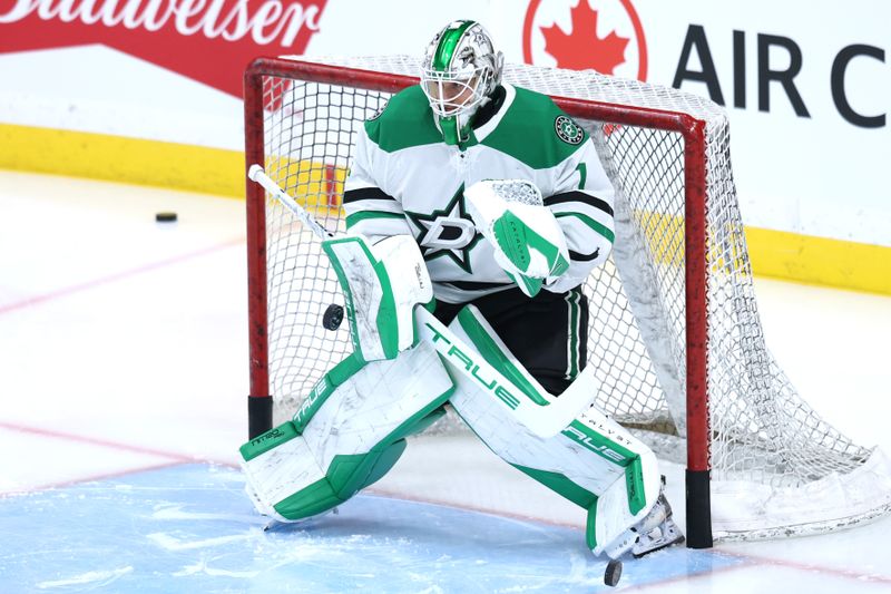 Dec 9, 2025; Winnipeg, Manitoba, CAN; Dallas Stars goaltender Casey Desmith (1) warms up before a game against the Winnipeg Jets at Canada Life Centre. Mandatory Credit: James Carey Lauder-Imagn Images