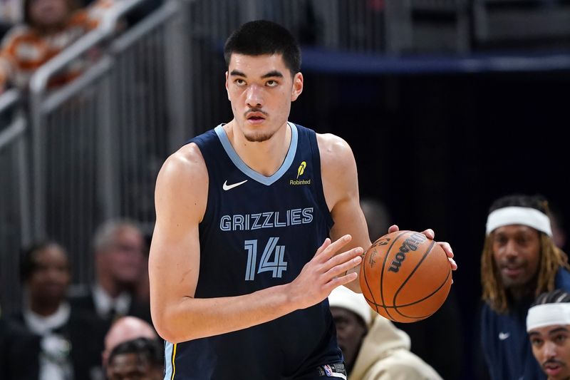 INDIANAPOLIS, INDIANA - OCTOBER 14: Zach Edey #14 of the Memphis Grizzlies dribbles the ball in the first quarter against the Indiana Pacers during a preseason game at Gainbridge Fieldhouse on October 14, 2024 in Indianapolis, Indiana. NOTE TO USER: User expressly acknowledges and agrees that, by downloading and or using this photograph, User is consenting to the terms and conditions of the Getty Images License Agreement. (Photo by Dylan Buell/Getty Images)