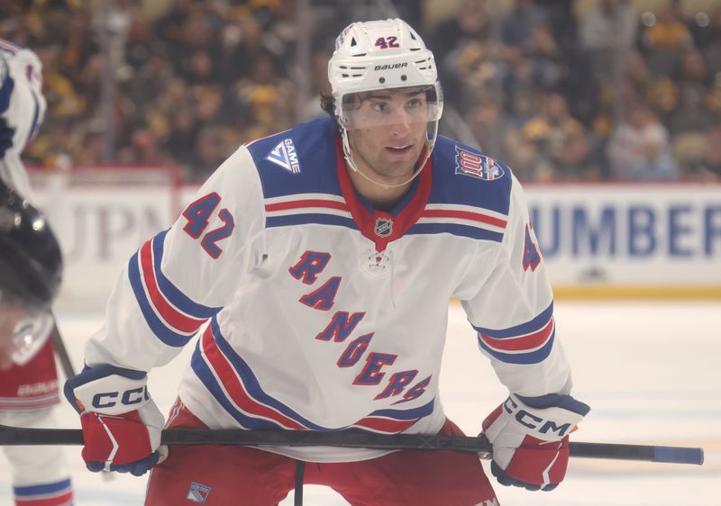 Oct 11, 2025; Pittsburgh, Pennsylvania, USA;  New York Rangers center Noah Laba (42) prepares to take a face-off against the Pittsburgh Penguins during the second period at PPG Paints Arena. Mandatory Credit: Charles LeClaire-Imagn Images