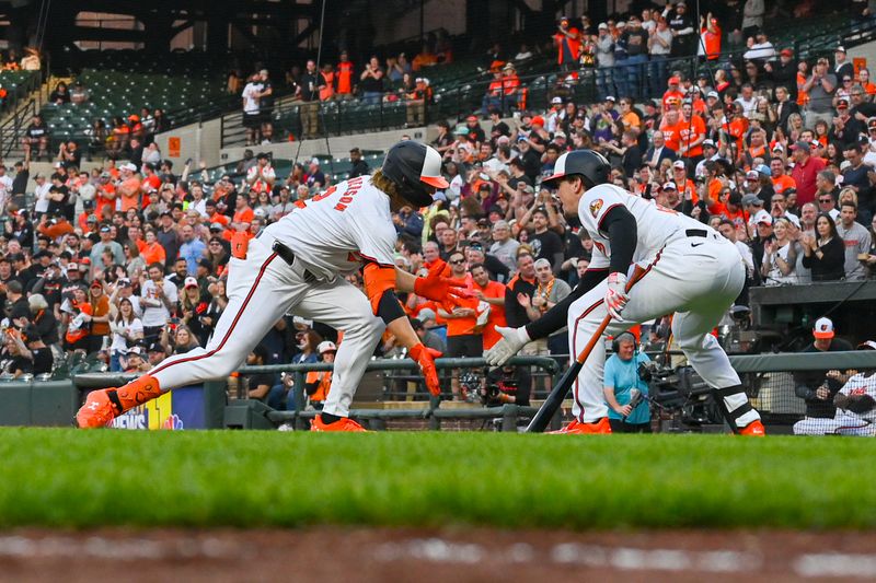 Apr 16, 2024; Baltimore, Maryland, USA;  Baltimore Orioles shortstop Gunnar Henderson (2) celebrates with  catcher Adley Rutschman (35) after hitting a 	wo run home run in the second inning against the Minnesota Twins at Oriole Park at Camden Yards. Mandatory Credit: Tommy Gilligan-USA TODAY Sports