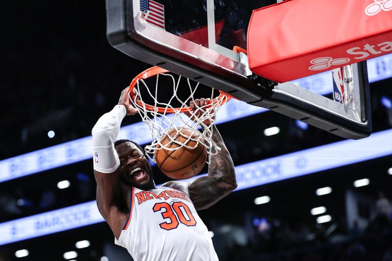 NEW YORK, NEW YORK - JANUARY 23: Julius Randle #30 of the New York Knicks dunks the ball during the fourth quarter of the game against the Brooklyn Nets at Barclays Center on January 23, 2024 in New York City.  NOTE TO USER: User expressly acknowledges and agrees that, by downloading and or using this photograph, User is consenting to the terms and conditions of the Getty Images License Agreement. (Photo by Dustin Satloff/Getty Images)