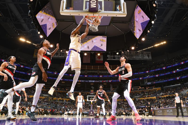 LOS ANGELES, CA - DECEMBER 8: Christian Koloko #10 of the Los Angeles Lakers dunks the ball during the game against the Portland Trail Blazers on December 8, 2024 at Crypto.Com Arena in Los Angeles, California. NOTE TO USER: User expressly acknowledges and agrees that, by downloading and/or using this Photograph, user is consenting to the terms and conditions of the Getty Images License Agreement. Mandatory Copyright Notice: Copyright 2024 NBAE (Photo by Adam Pantozzi/NBAE via Getty Images)