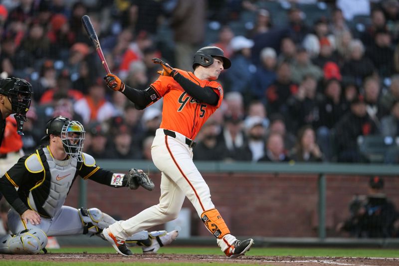 Apr 26, 2024; San Francisco, California, USA; San Francisco Giants right fielder Mike Yastrzemski (5) hits a single against the Pittsburgh Pirates during the second inning at Oracle Park. Mandatory Credit: Darren Yamashita-USA TODAY Sports