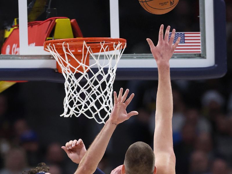 DENVER, COLORADO - FEBRUARY 22: Nikola Jokic #15 of the Denver Nuggets puts up a shot over Corey Kispert #24 of the Washington Wizards in the first quarter at Ball Arena on February 22, 2024 in Denver, Colorado. NOTE TO USER: User expressly acknowledges and agrees that, by downloading and or using this photograph, User is consenting to the terms and conditions of the Getty Images License Agreement. (Photo by Matthew Stockman/Getty Images)