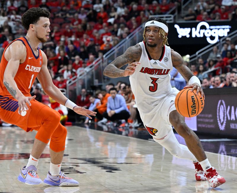 Feb 18, 2023; Louisville, Kentucky, USA;  Louisville Cardinals guard El Ellis (3) dribbles against Clemson Tigers guard Chase Hunter (1) during the second half at KFC Yum! Center. Louisville defeated Clemson 83-73. Mandatory Credit: Jamie Rhodes-USA TODAY Sports