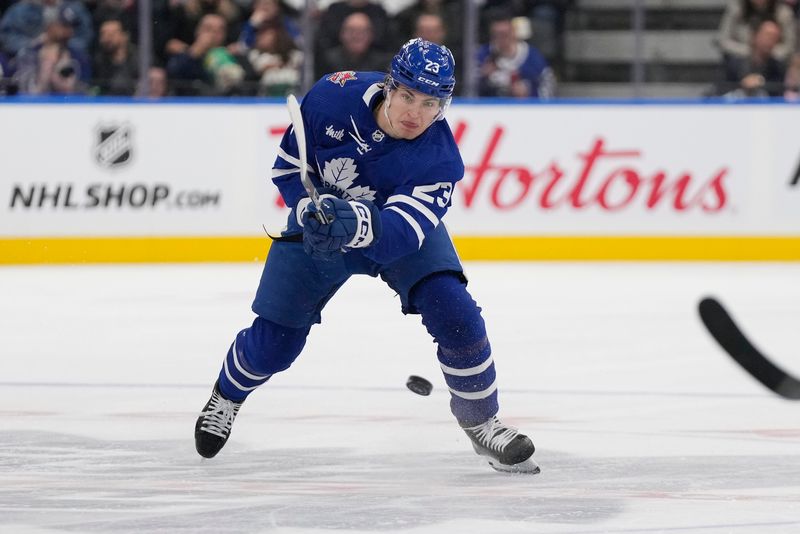 Nov 6, 2023; Toronto, Ontario, CAN; Toronto Maple Leafs forward Matthew Knies (23) shoots the puck into the Tampa Bay Lightning zone during the first period at Scotiabank Arena. Mandatory Credit: John E. Sokolowski-USA TODAY Sports