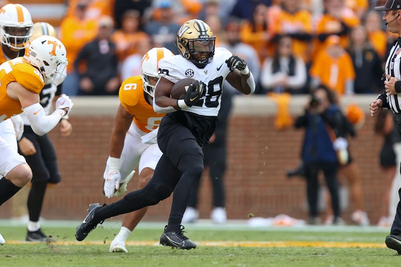 Nov 25, 2023; Knoxville, Tennessee, USA; Vanderbilt Commodores running back Sedrick Alexander (28) runs the ball against the Tennessee Volunteers during the first half at Neyland Stadium. Mandatory Credit: Randy Sartin-USA TODAY Sports