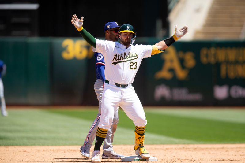 May 8, 2024; Oakland, California, USA; Oakland Athletics catcher Shea Langeliers (23) celebrates his two-RBI double against the Texas Rangers during the fourth inning at Oakland-Alameda County Coliseum. Mandatory Credit: D. Ross Cameron-USA TODAY Sports