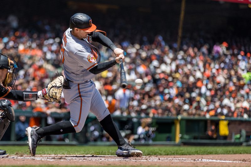 Jun 4, 2023; San Francisco, California, USA;  Baltimore Orioles left fielder Austin Hays (21) hits an RBI single against the San Francisco Giants during the third inning at Oracle Park. Mandatory Credit: John Hefti-USA TODAY Sports