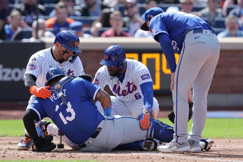 Apr 14, 2024; New York City, New York, USA; Kansas City Royals catcher Salvador Perez (13) is helped up by New York Mets catcher Francisco Alvarez (4) and designated hitter Starling Marte (6) and Royals starting pitcher Cole Ragans (55) after a collision at home plate with Marte during the fourth inning at Citi Field. Mandatory Credit: Brad Penner-USA TODAY Sports