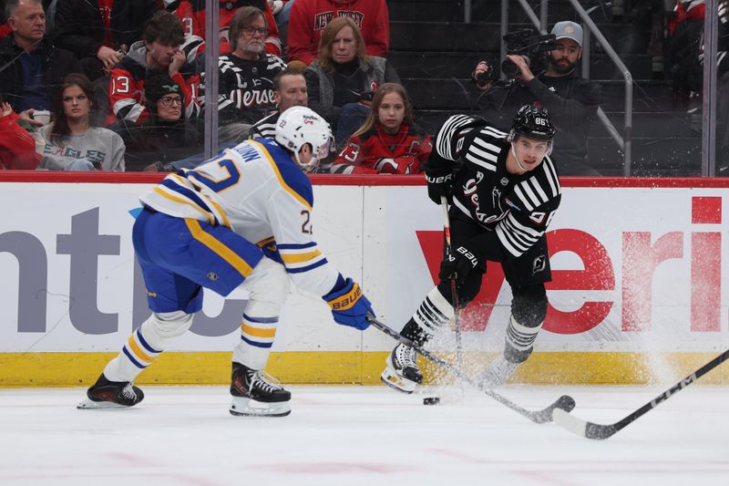 Dec 21, 2025; Newark, New Jersey, USA;  New Jersey Devils center Jack Hughes (86) looks to make a pass against the Buffalo Sabres during the first period at Prudential Center. Mandatory Credit: Thomas Salus-Imagn Images