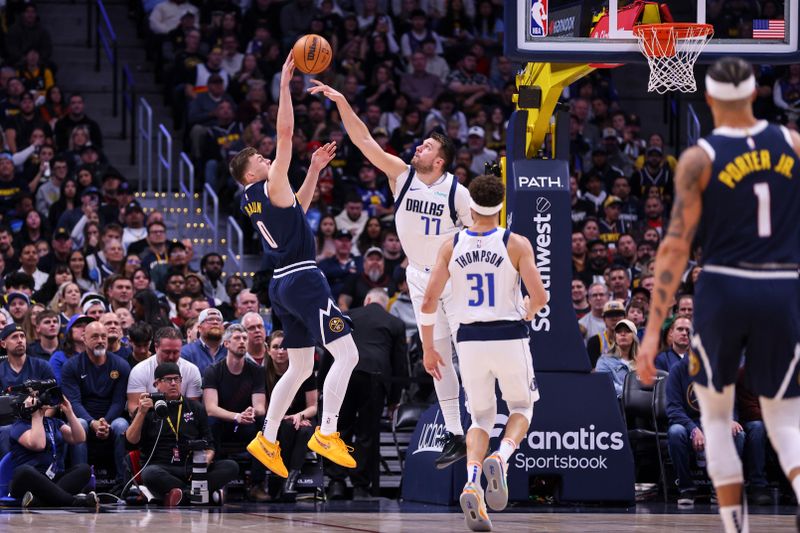 DENVER, COLORADO - NOVEMBER 10: Luka Doncic #77 of the Dallas Mavericks blocks a shot by Christian Braun #0 of the Denver Nuggets in the first half at Ball Arena on November 10, 2024 in Denver, Colorado. NOTE TO USER: User expressly acknowledges and agrees that, by downloading and or using this photograph, user is consenting to the terms and conditions of the Getty Images License Agreement. (Photo by Tyler Schank/Clarkson Creative/Getty Images)