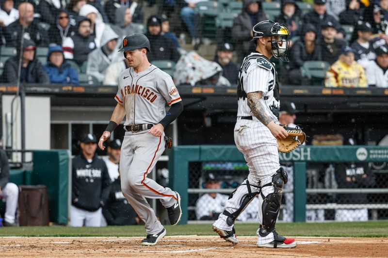 Apr 3, 2023; Chicago, Illinois, USA; San Francisco Giants center fielder Mike Yastrzemski (5) scores against the Chicago White Sox during the second inning at Guaranteed Rate Field. Mandatory Credit: Kamil Krzaczynski-USA TODAY Sports