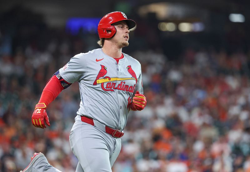 Jun 4, 2024; Houston, Texas, USA; St. Louis Cardinals second baseman Nolan Gorman (16) hits a single during the first inning against the Houston Astros at Minute Maid Park. Mandatory Credit: Troy Taormina-USA TODAY Sports