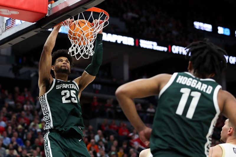 Mar 15, 2024; Minneapolis, MN, USA; Michigan State Spartans forward Malik Hall (25) dunks against the Purdue Boilermakers during the second half at Target Center. Mandatory Credit: Matt Krohn-USA TODAY Sports