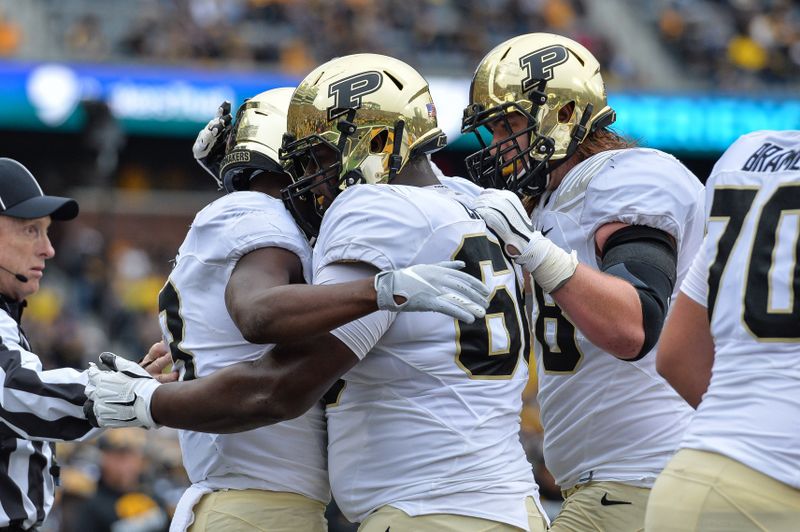 Oct 19, 2019; Iowa City, IA, USA; Purdue Boilermakers wide receiver David Bell (3) reacts with offensive lineman Cam Craig (68) after catching a touchdown pass from quarterback Jack Plummer (13) during the second quarter against the Iowa Hawkeyes at Kinnick Stadium. Mandatory Credit: Jeffrey Becker-USA TODAY Sports