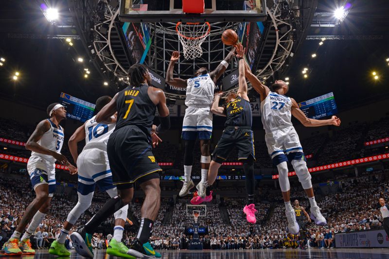 MINNEAPOLIS, MN -  MAY 6: Anthony Edwards #5 of the Minnesota Timberwolves goes up for the rebound during the game against the Golden State Warriors during Round 2 Game 1 of the 2025 NBA Playoffs on May 6, 2025 at Target Center in Minneapolis, Minnesota. NOTE TO USER: User expressly acknowledges and agrees that, by downloading and or using this Photograph, user is consenting to the terms and conditions of the Getty Images License Agreement. Mandatory Copyright Notice: Copyright 2025 NBAE (Photo by Jesse D. Garrabrant/NBAE via Getty Images)