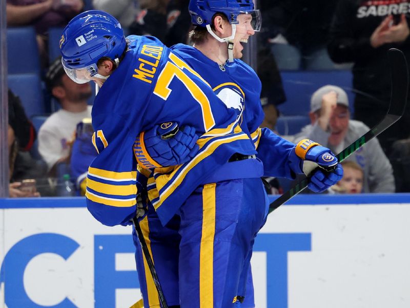 Nov 5, 2024; Buffalo, New York, USA;  Buffalo Sabres defenseman Bowen Byram (4) celebrates his goal with center Ryan McLeod (71) during the second period against the Ottawa Senators at KeyBank Center. Mandatory Credit: Timothy T. Ludwig-Imagn Images