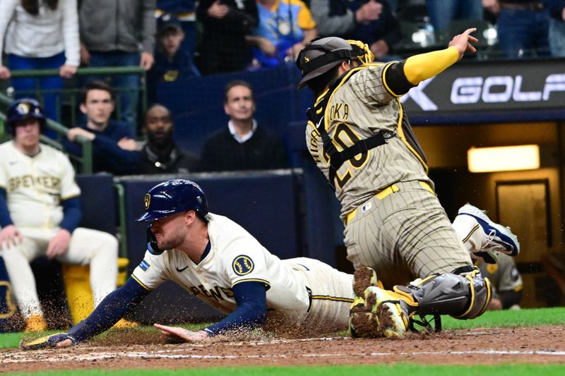 Apr 17, 2024; Milwaukee, Wisconsin, USA; Milwaukee Brewers second baseman Brice Turang (2) scores before tag by San Diego Padres catcher Kyle Higashioka (20) in the eighth inning at American Family Field. Mandatory Credit: Benny Sieu-USA TODAY Sports