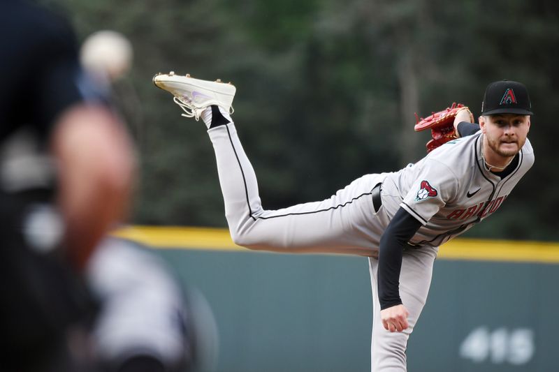Aug 16, 2025; Denver, Colorado, USA; Arizona Diamondbacks pitcher Ryne Nelson (19) throws during the first inning against the Colorado Rockies at Coors Field. Mandatory Credit: Christopher Hanewinckel-Imagn Images