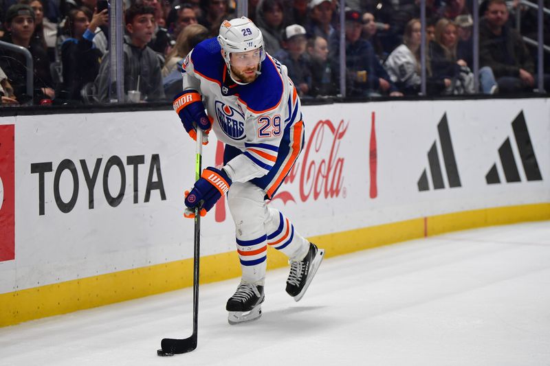 Dec 30, 2023; Los Angeles, California, USA; Edmonton Oilers center Leon Draisaitl (29) controls the puck against the Los Angeles Kings during the third period at Crypto.com Arena. Mandatory Credit: Gary A. Vasquez-USA TODAY Sports