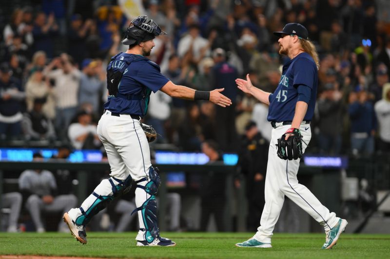 Jun 11, 2024; Seattle, Washington, USA; Seattle Mariners catcher Cal Raleigh (29) and relief pitcher Ryne Stanek (45) celebrate defeating the Chicago White Sox during at T-Mobile Park. Mandatory Credit: Steven Bisig-USA TODAY Sports