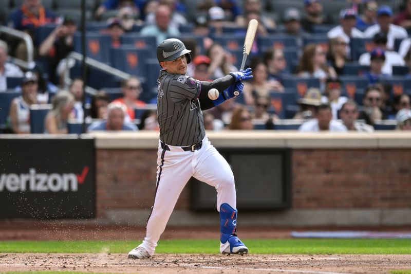 Jun 29, 2024; New York City, New York, USA; New York Mets second baseman Jose Iglesias (11) hits a RBI single against the Houston Astros during the second inning at Citi Field. Mandatory Credit: John Jones-USA TODAY Sports