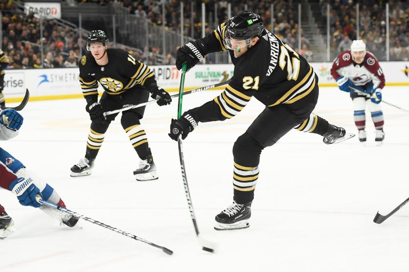 Jan 18, 2024; Boston, Massachusetts, USA; Boston Bruins left wing James van Riemsdyk (21) shoots the puck during the third period against the Colorado Avalanche at TD Garden. Mandatory Credit: Bob DeChiara-USA TODAY Sports